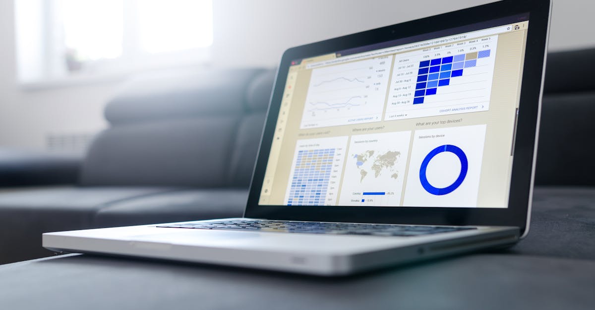 Sleek laptop showcasing data analytics and graphs on the screen in a bright room.