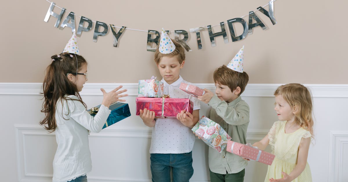 Kids enjoying a birthday party with gifts and decorations.