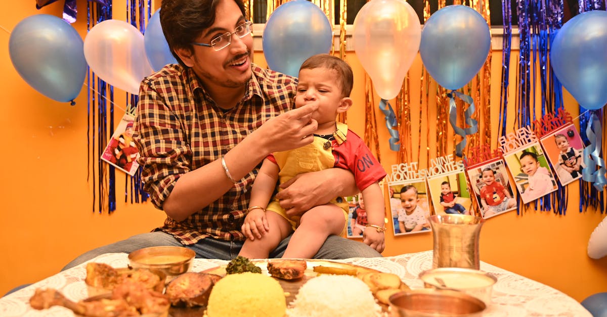 Father Feeding His Son During a Birthday Party