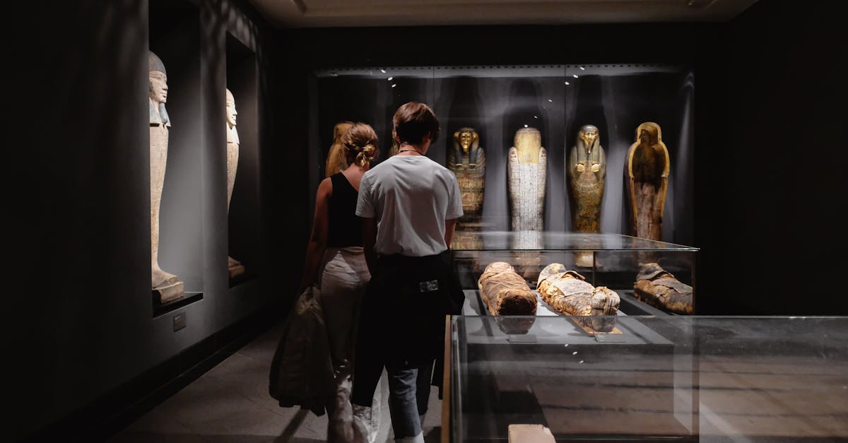 Visitors explore Egyptian artifacts at a museum in Copenhagen.