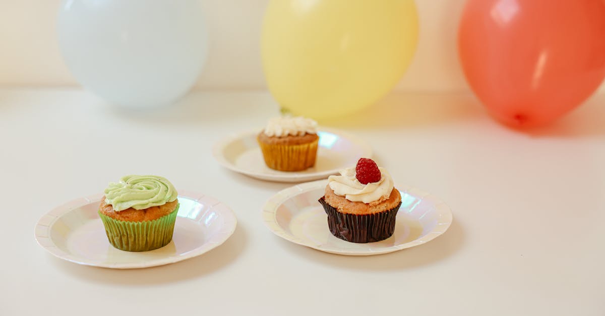 Delicious cupcakes with colorful balloons create a festive celebration atmosphere.