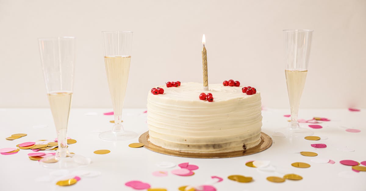 Celebrate with a frosted cake and champagne in a festive setup with confetti.